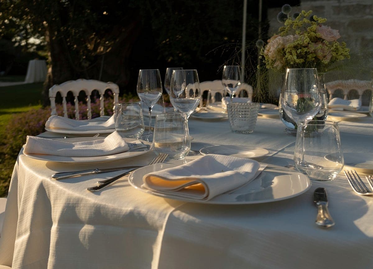 The table laid as the sun goes down over the vineyard